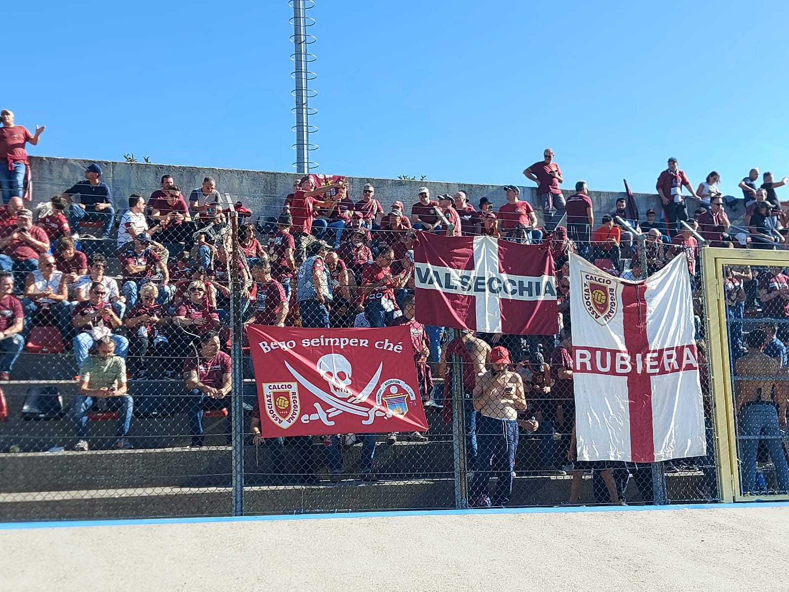 Reggiana fans with the Morton badge on their flag