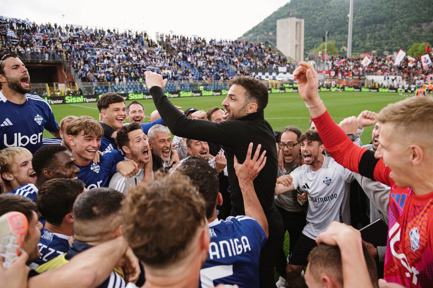 Cesc Fabregas celebrates survival with his Como squad
